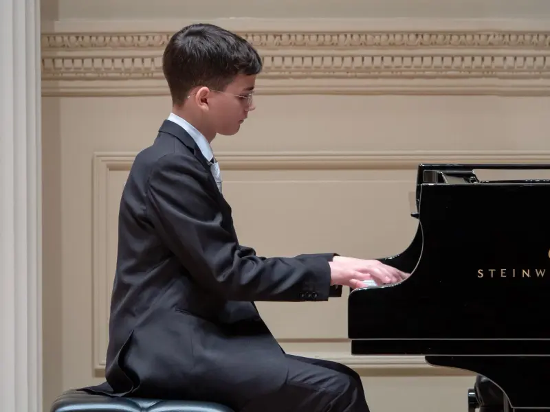 Student playing the piano